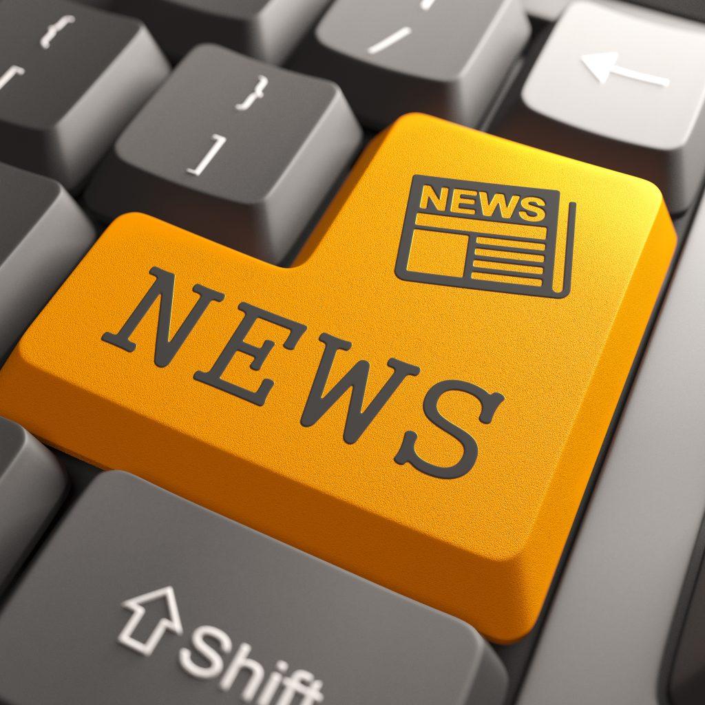 orange keyboard button with the word news
