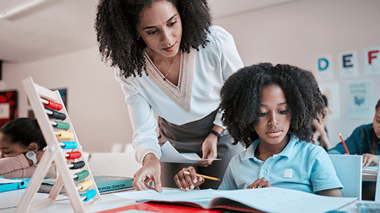 a teacher helping a student with an exercise