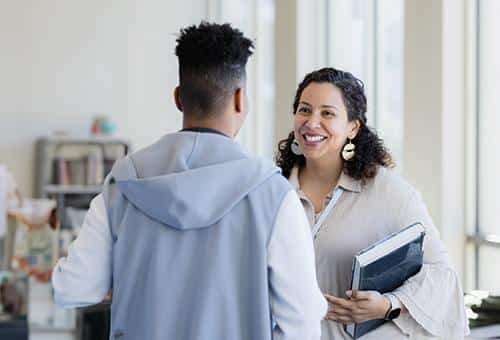 a teacher talking to a student