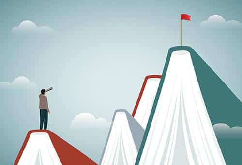 graphic of mountains made from open books with a man looking through a telescope to a flag on the highest book