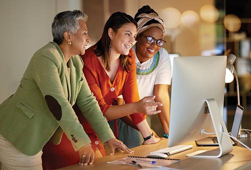 group of people looking at a computer screen
