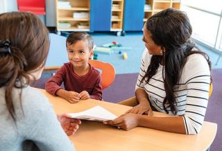 teachers and a student in the classroom